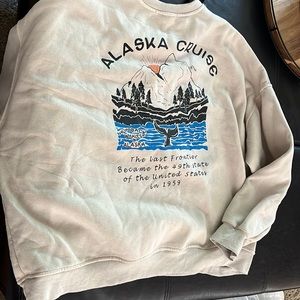 tan hoodie with graphic on back and front